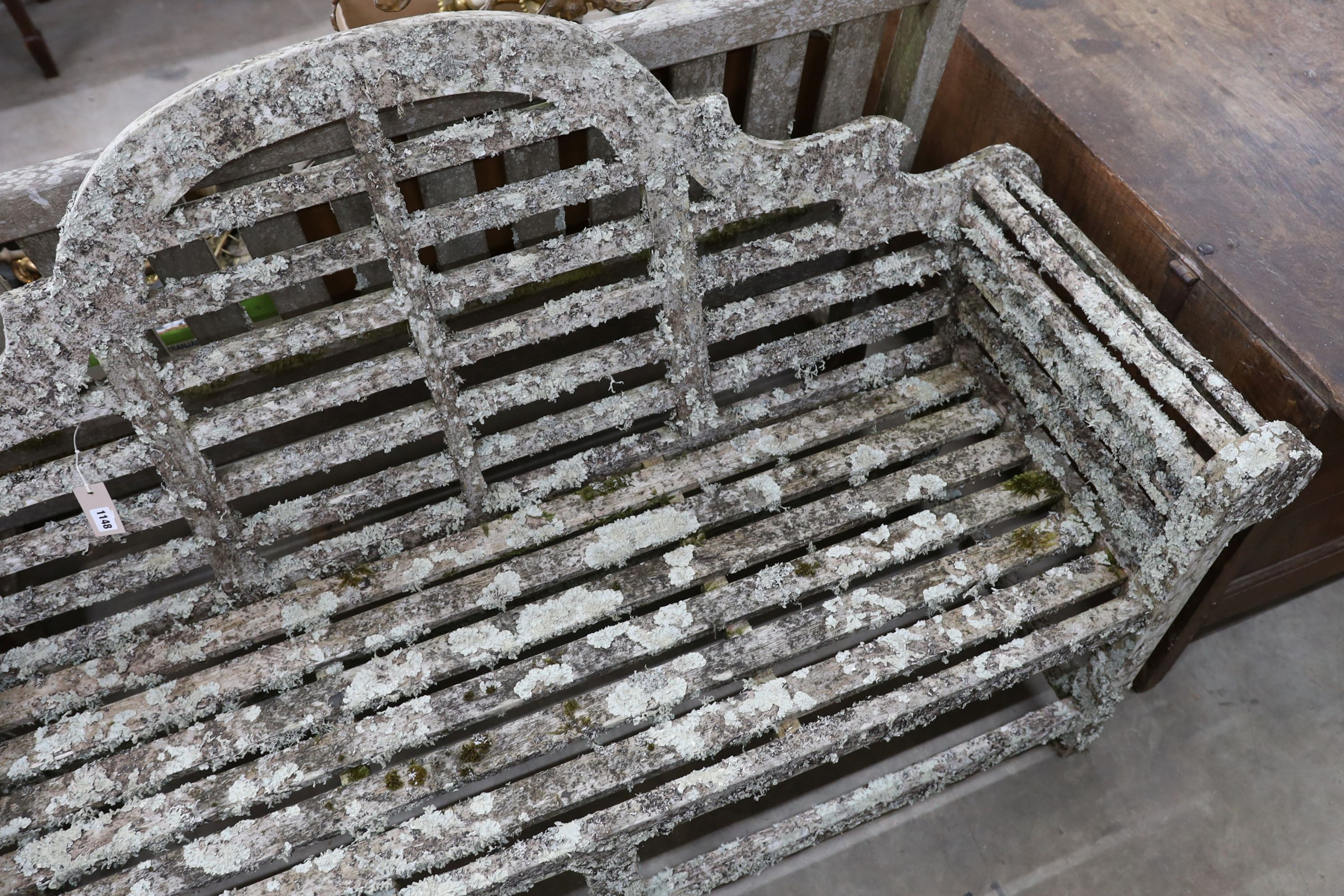 A Lutyens style lichen covered teak garden bench, length 160cm, depth 52cm, height 102cm